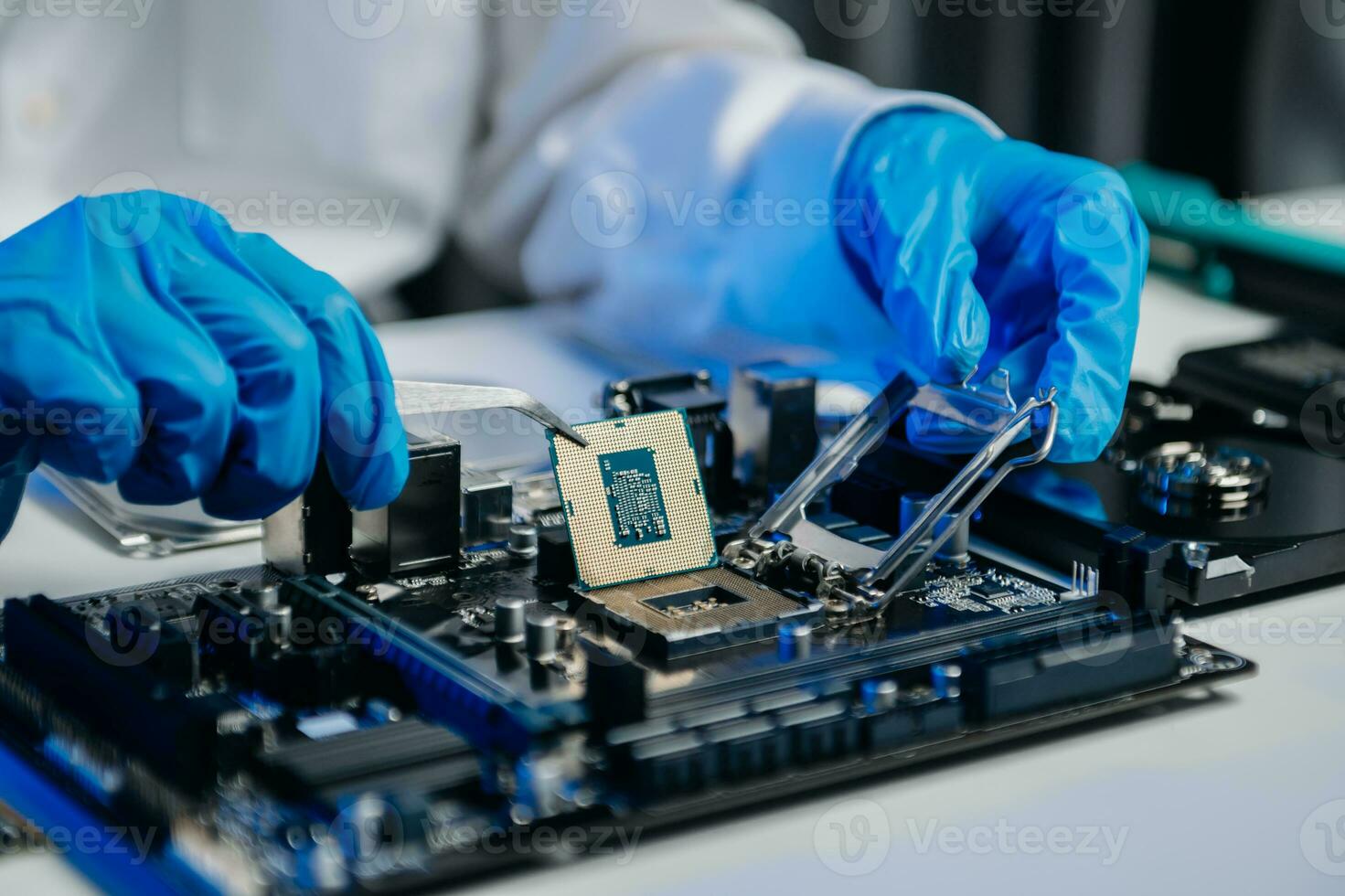 The technician is putting the CPU on the socket of the computer motherboard. electronic engineering electronic repair, electronics photo