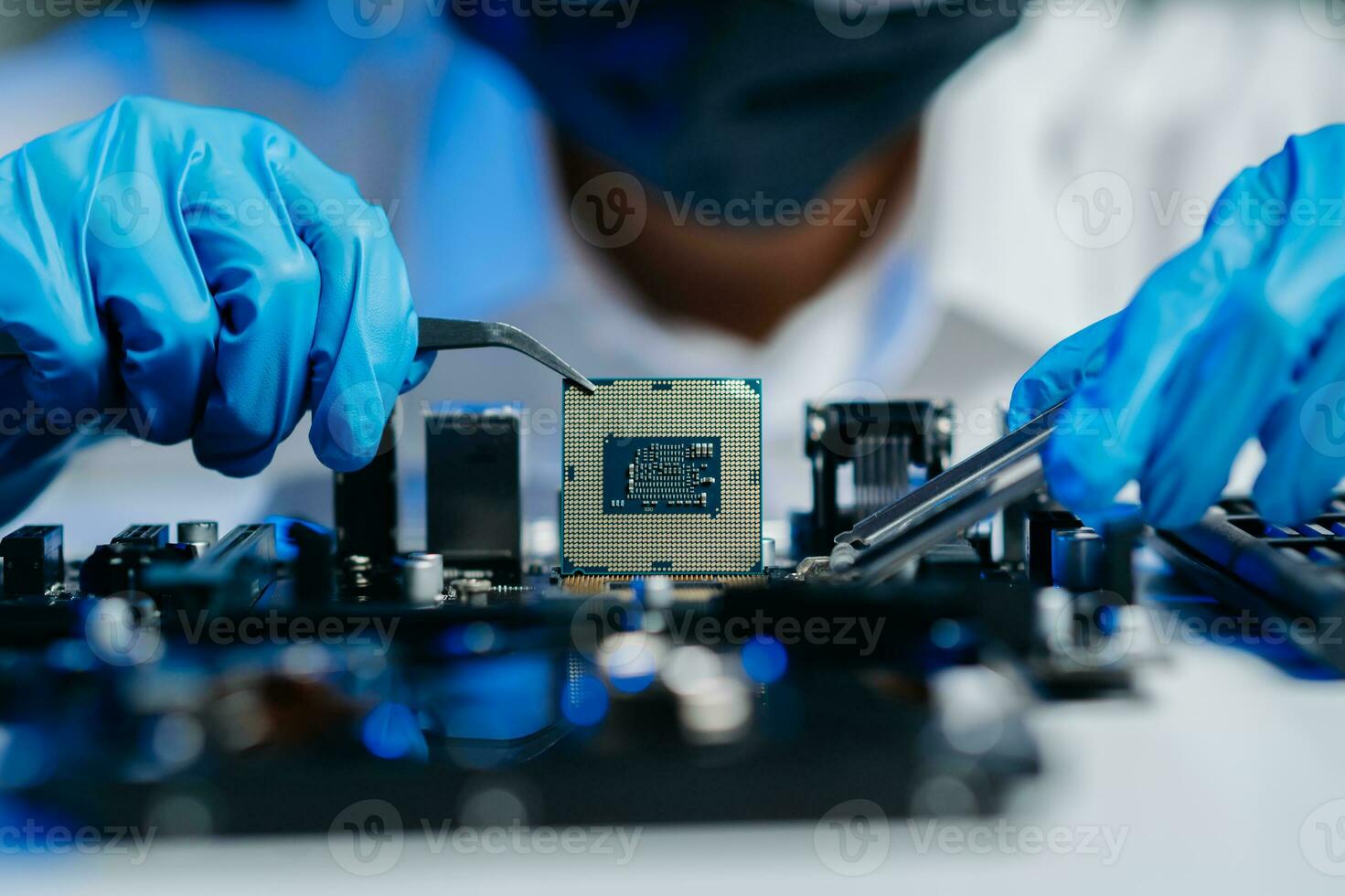 The technician is putting the CPU on the socket of the computer motherboard. electronic engineering electronic repair, electronics photo