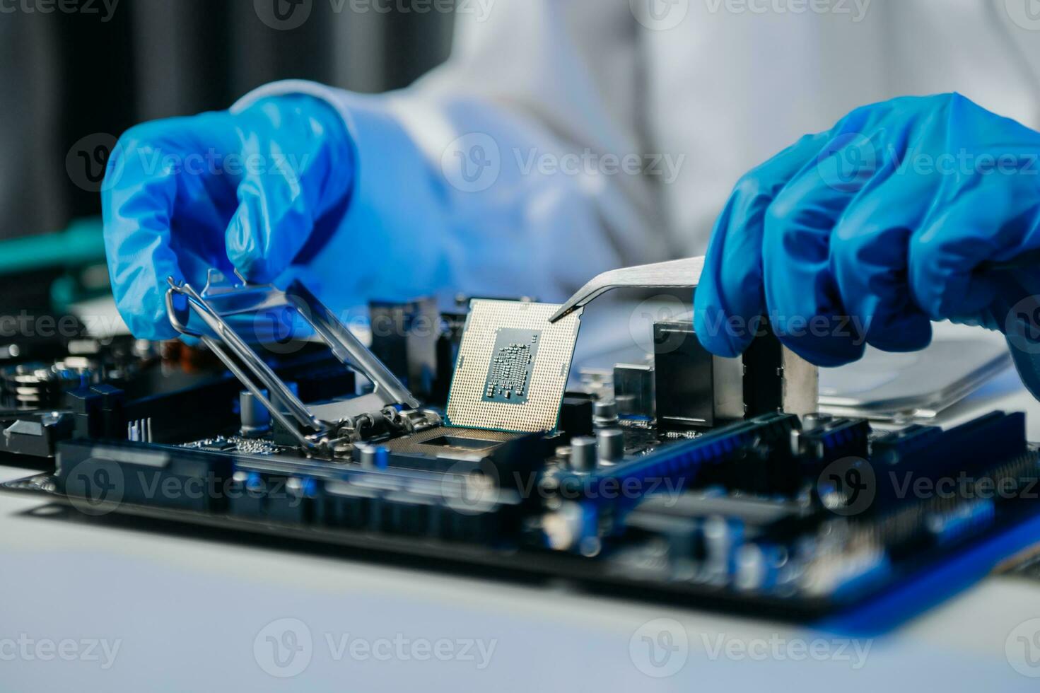 The technician is putting the CPU on the socket of the computer motherboard. electronic engineering electronic repair, electronics photo