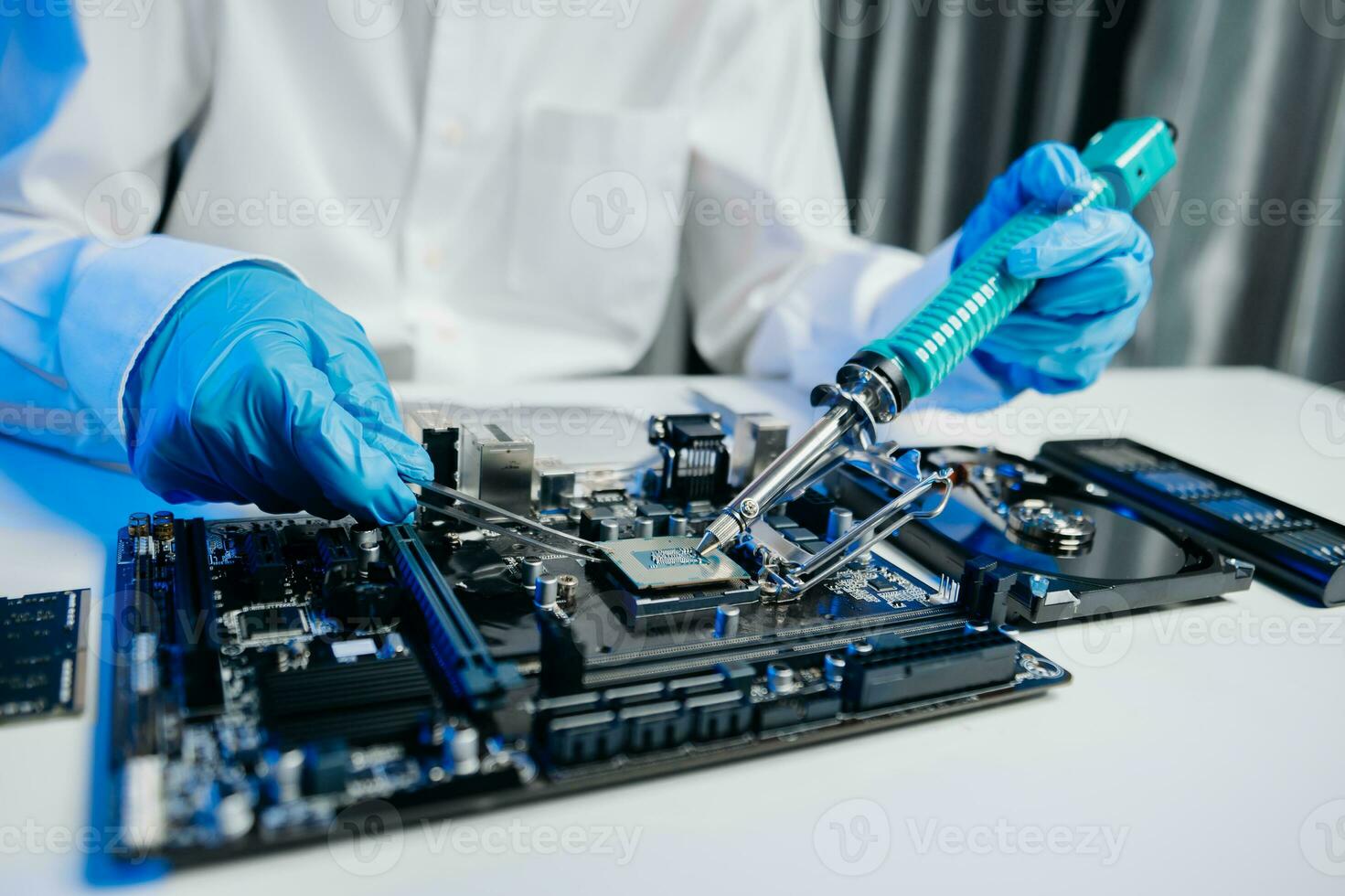 The technician is putting the CPU on the socket of the computer motherboard. electronic engineering electronic repair, electronics photo