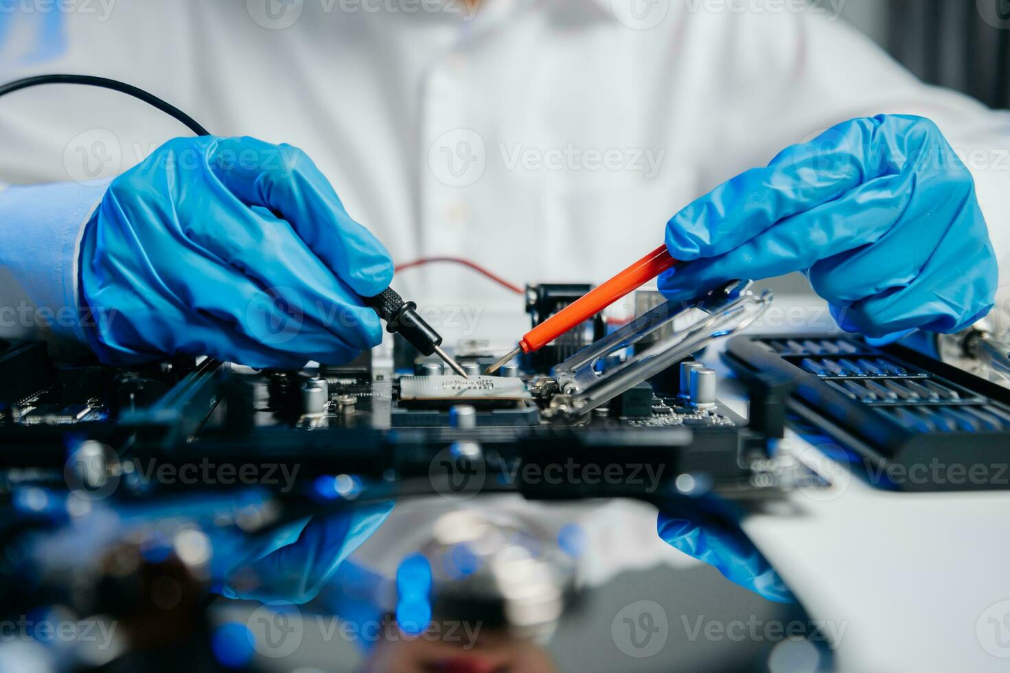 The technician is putting the CPU on the socket of the computer motherboard. electronic engineering electronic repair, electronics photo