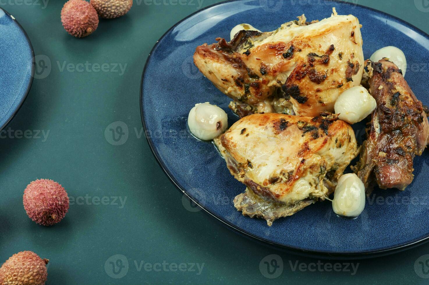 Plate of chicken roasted with lychee. photo