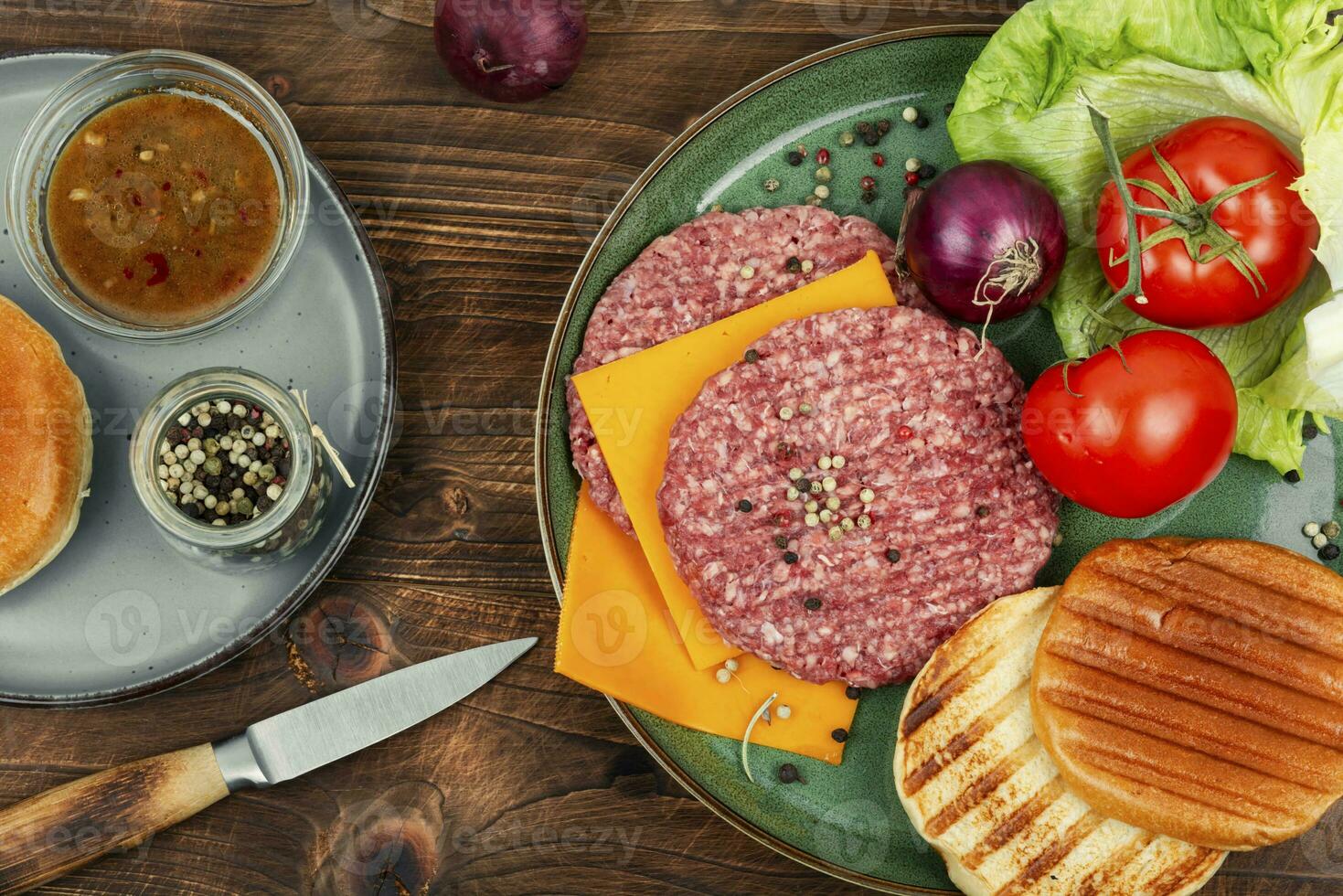 Juicy raw burger patty photo