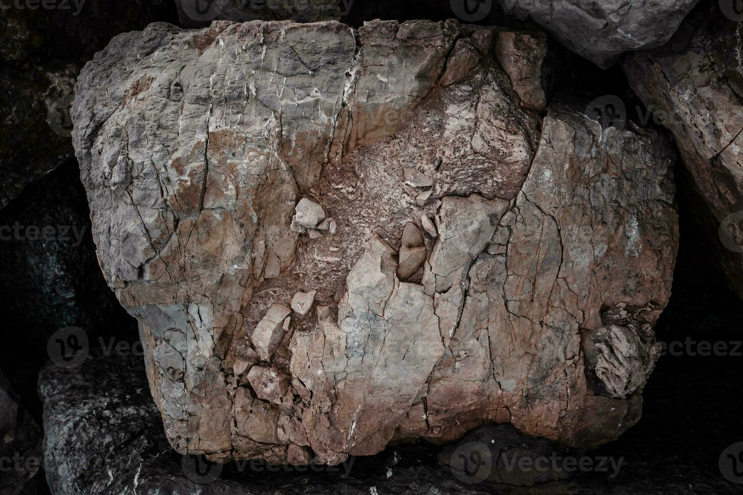 Sea cracked granite textured rock concept photo. Mountain rough surface. photo