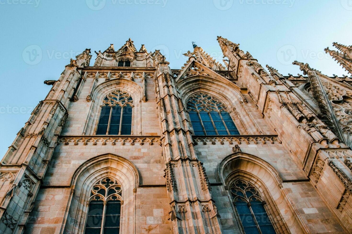 Cityscape photo of the Basilica of Saints Justus and Pastor, Barcelona. Street scene in Catalonia