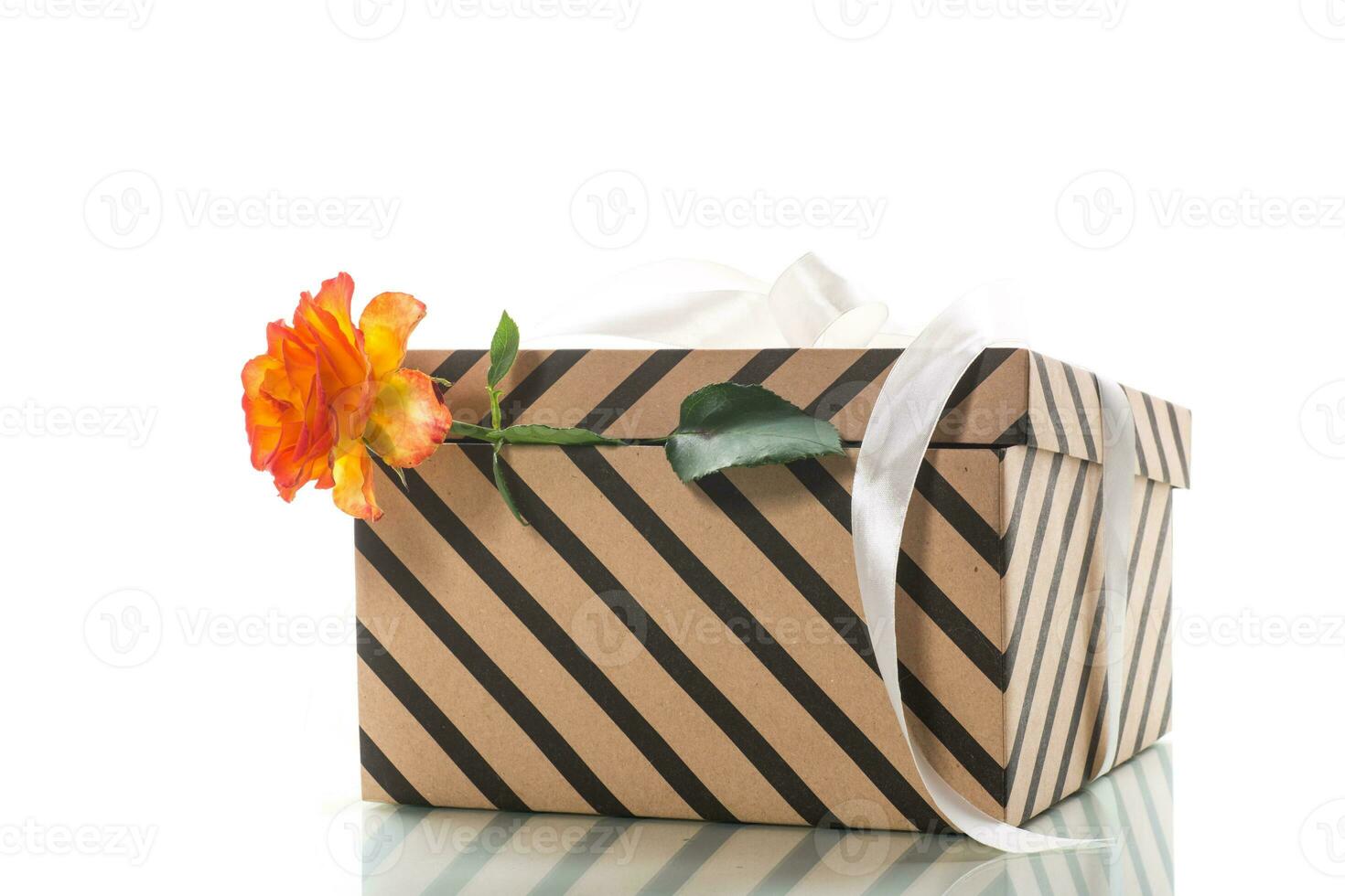 gift box with ribbons and beautiful roses inside. photo