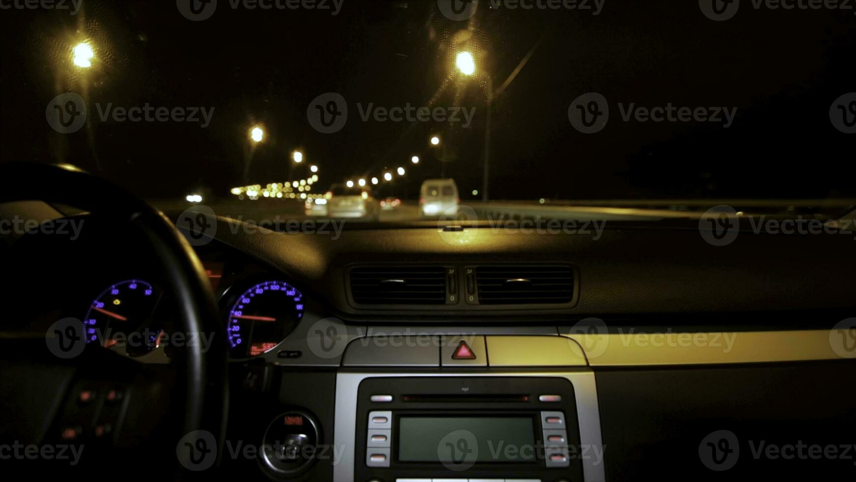 Car driving at night. Driving car in the city view from the interior. Timelapse of driving at night with camera in car photo