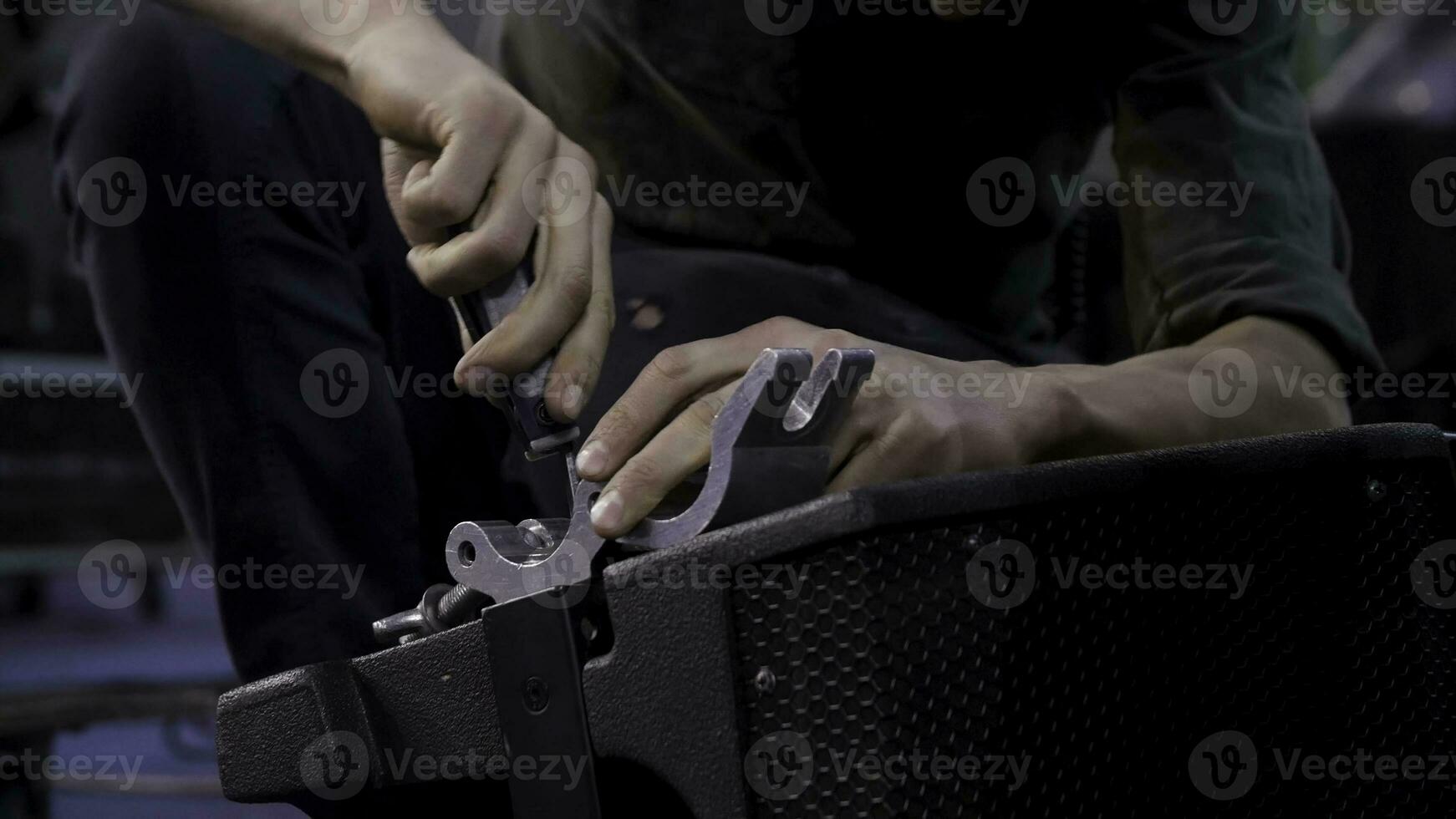 Close up of hands screwing together furniture pieces. Man screwing a screw with screwdriver. photo