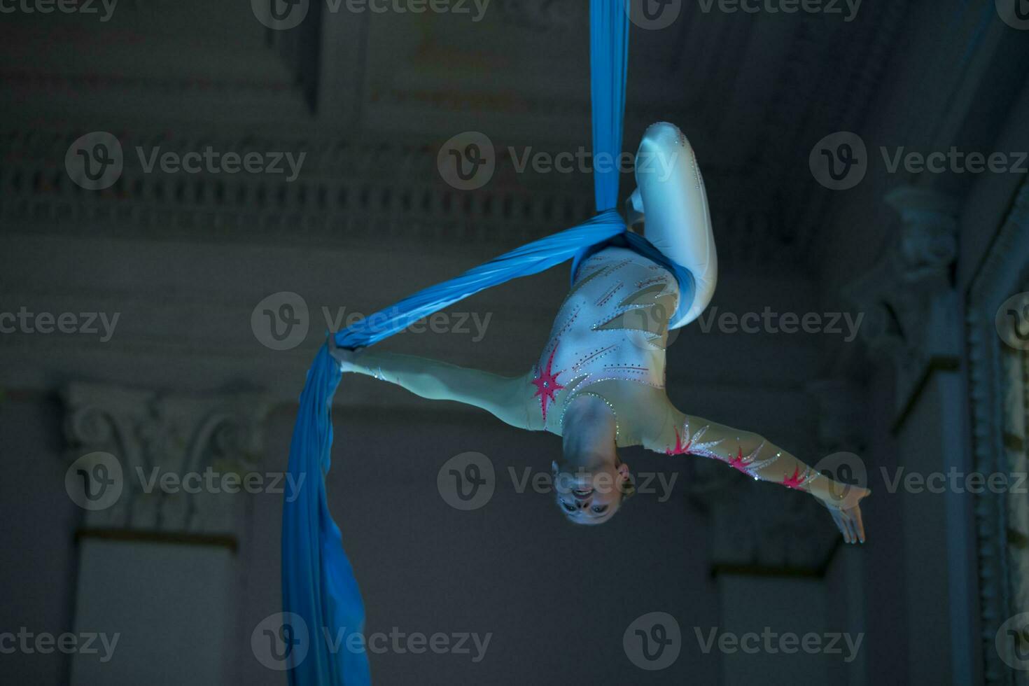 Speech gymnasts on the canvases. Girl on acrobatic canvases.Dangerous Circus Tricks.Aerial gymnast photo