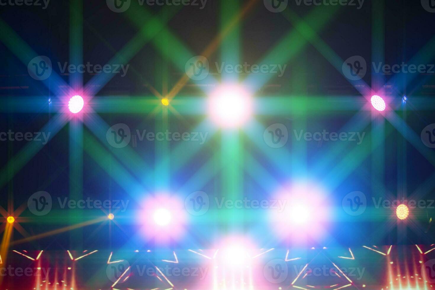 Bright multicolored iridescent lights of stage lighting. Background
