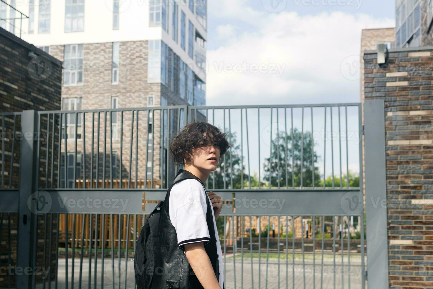 young man on the street against the urban landscape photo