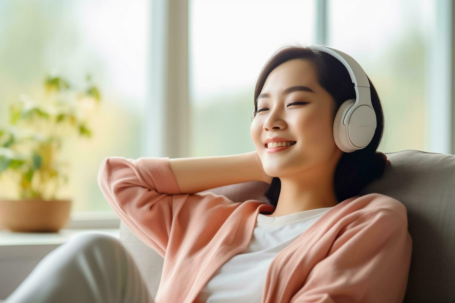 AI generated photo Happy beautiful young asian woman relaxing on sofa with headphones in living room.AI Generated
