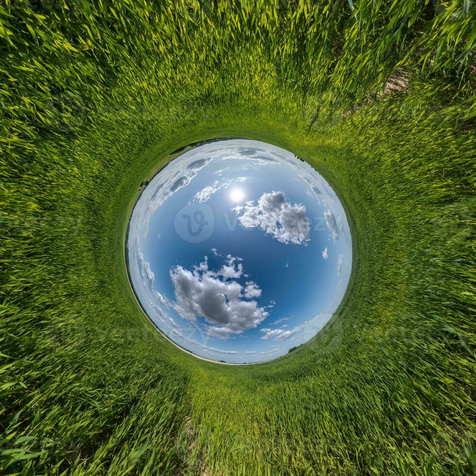 blue hole sphere little planet inside green grass round frame background photo
