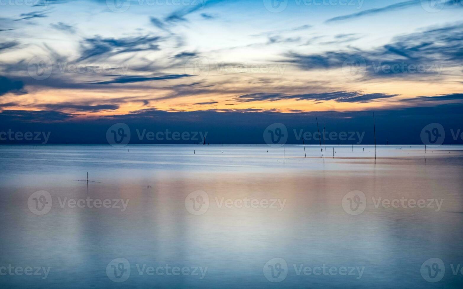 Blue sea of tranquility at twilight photo