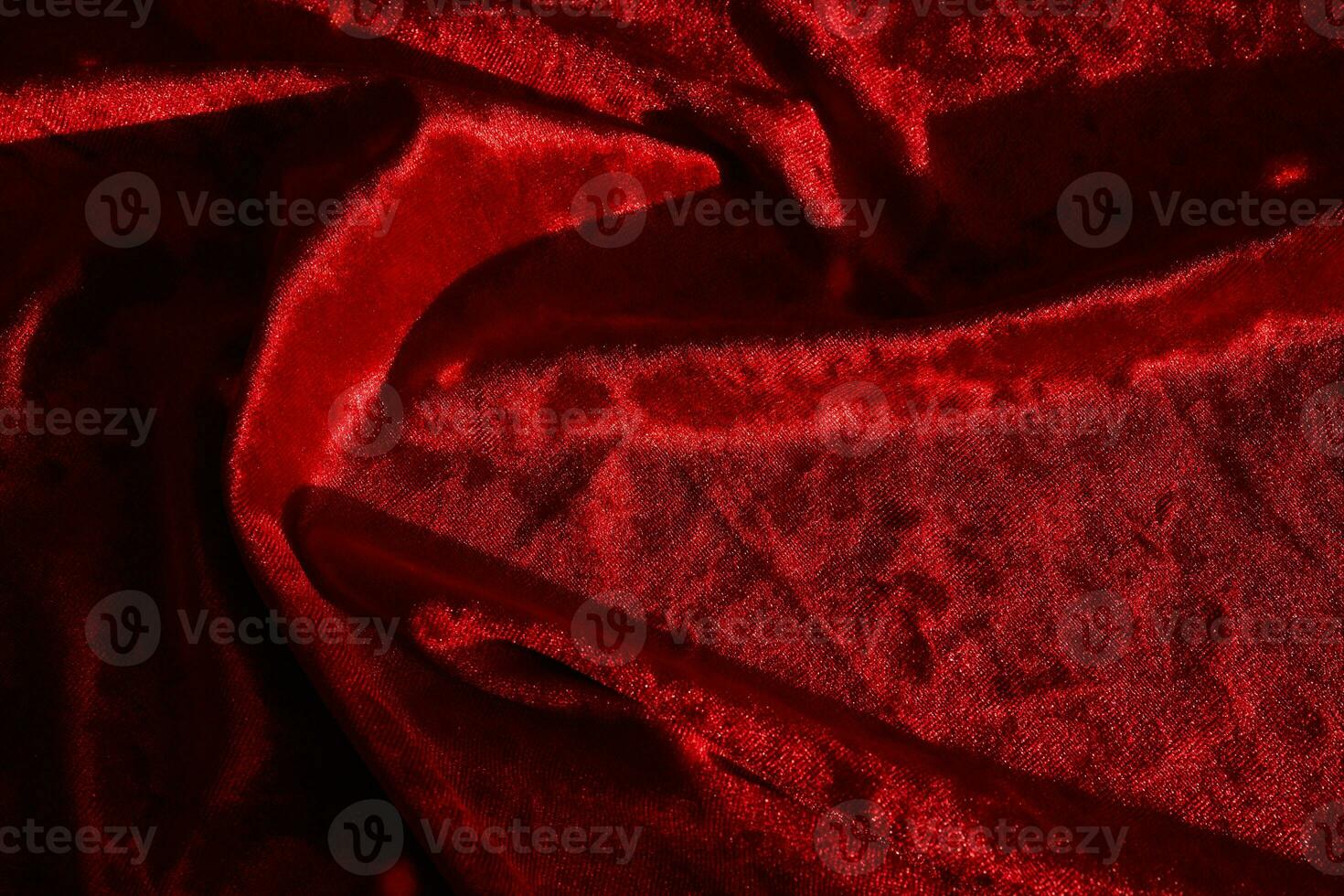 Abstract background made of red velvet fabric. photo