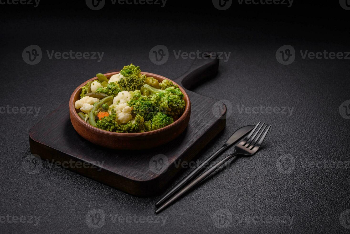 Delicious fresh vegetables steamed carrots, broccoli, cauliflower photo