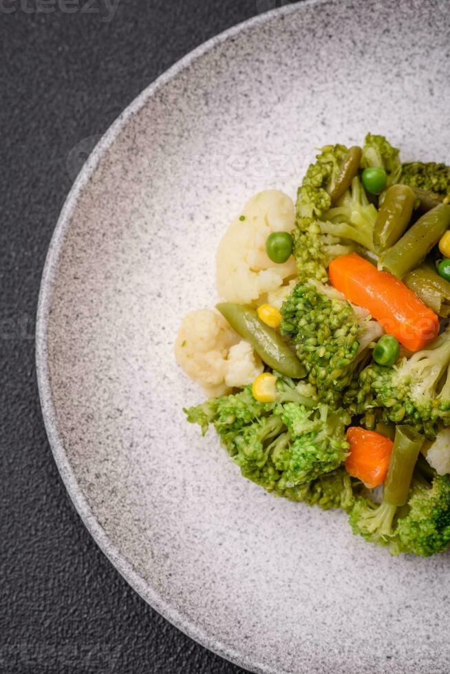 Delicious fresh vegetables steamed carrots, broccoli, cauliflower photo