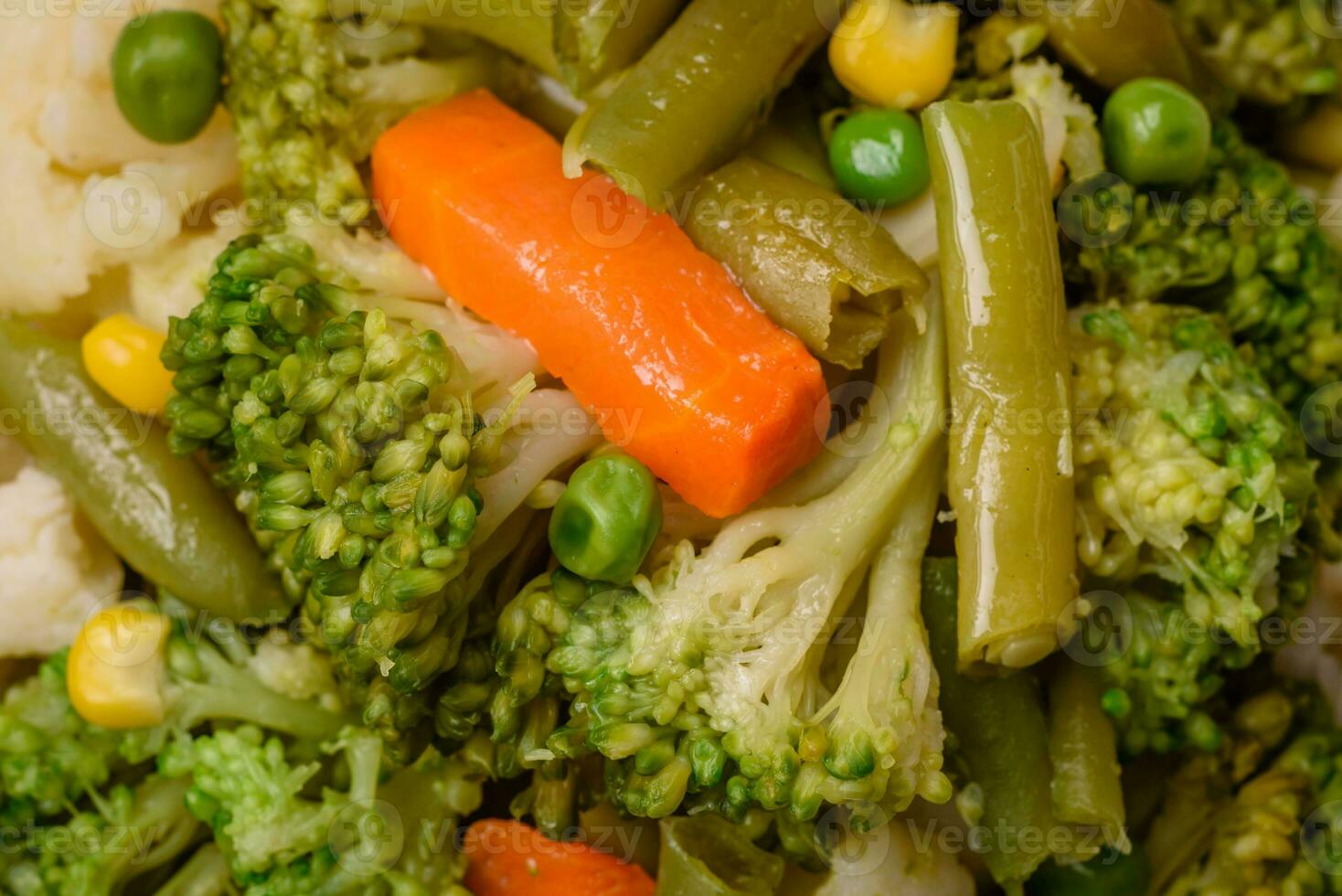 Delicious fresh vegetables steamed carrots, broccoli, cauliflower photo