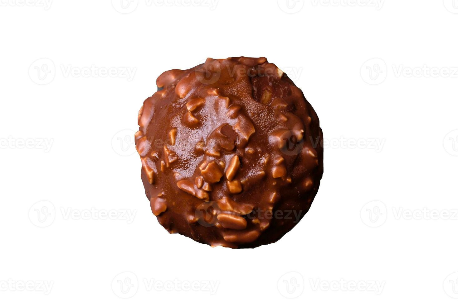 Delicious chocolate tart with nuts on a black ceramic plate photo