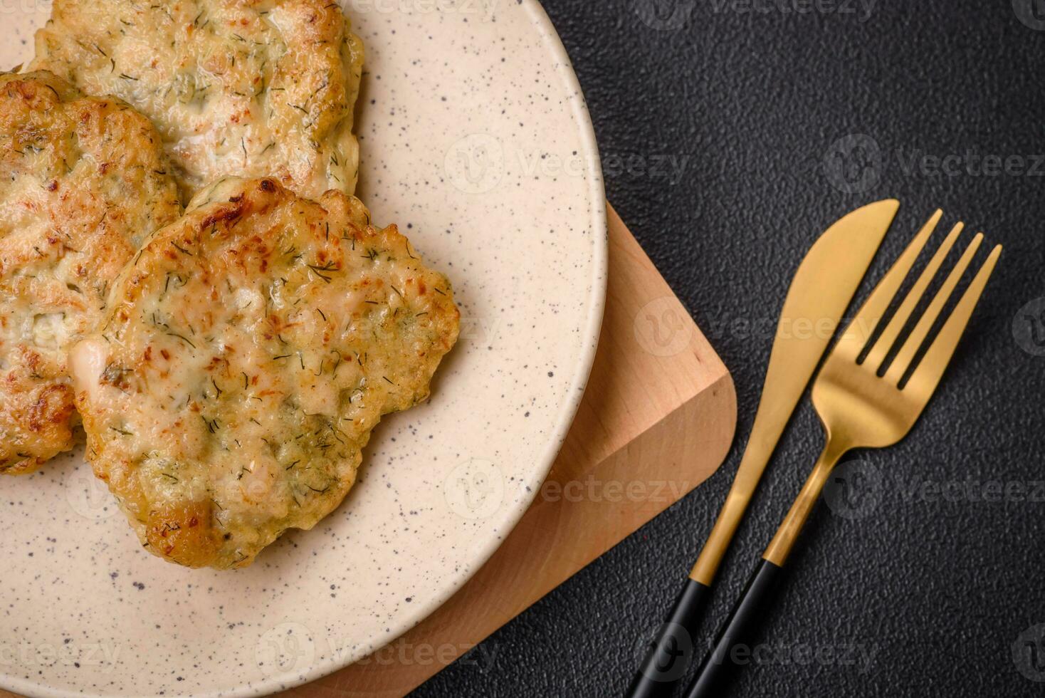 Delicious fresh fried minced fish cutlets with spices and herbs photo