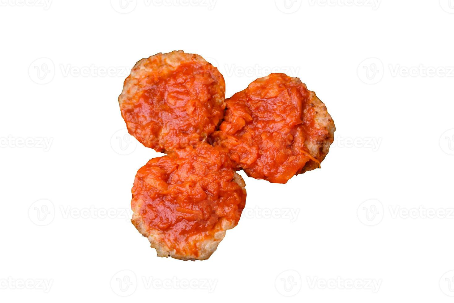 Delicious fresh cutlets or meatballs with spices, herbs and tomato sauce photo