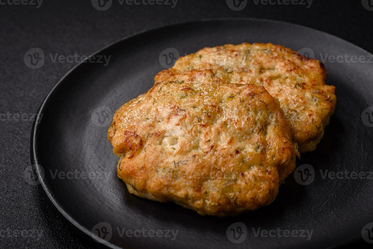 Delicious fresh fried minced fish cutlets with spices and herbs photo