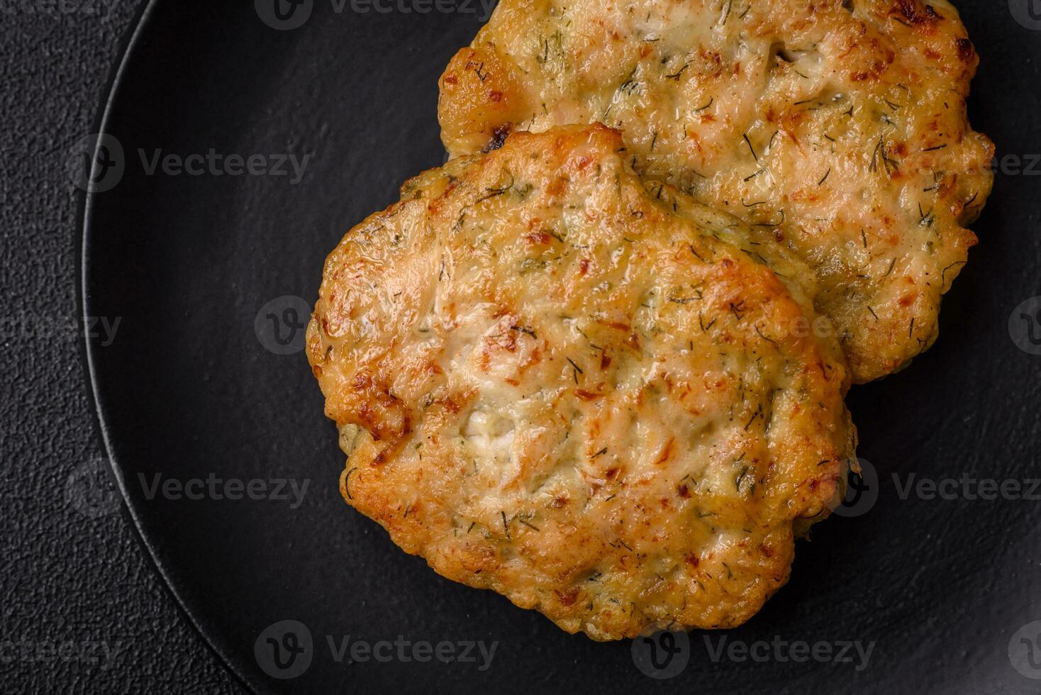 Delicious fresh fried minced fish cutlets with spices and herbs photo