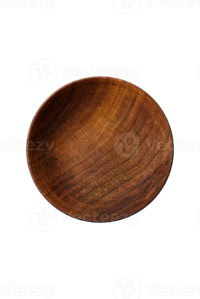 A cylindrical empty container made of wood for spices or salt photo