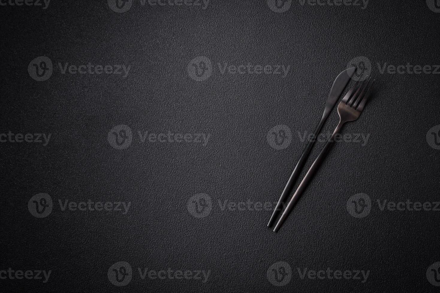 Kitchen knife and fork made of steel with copy space photo