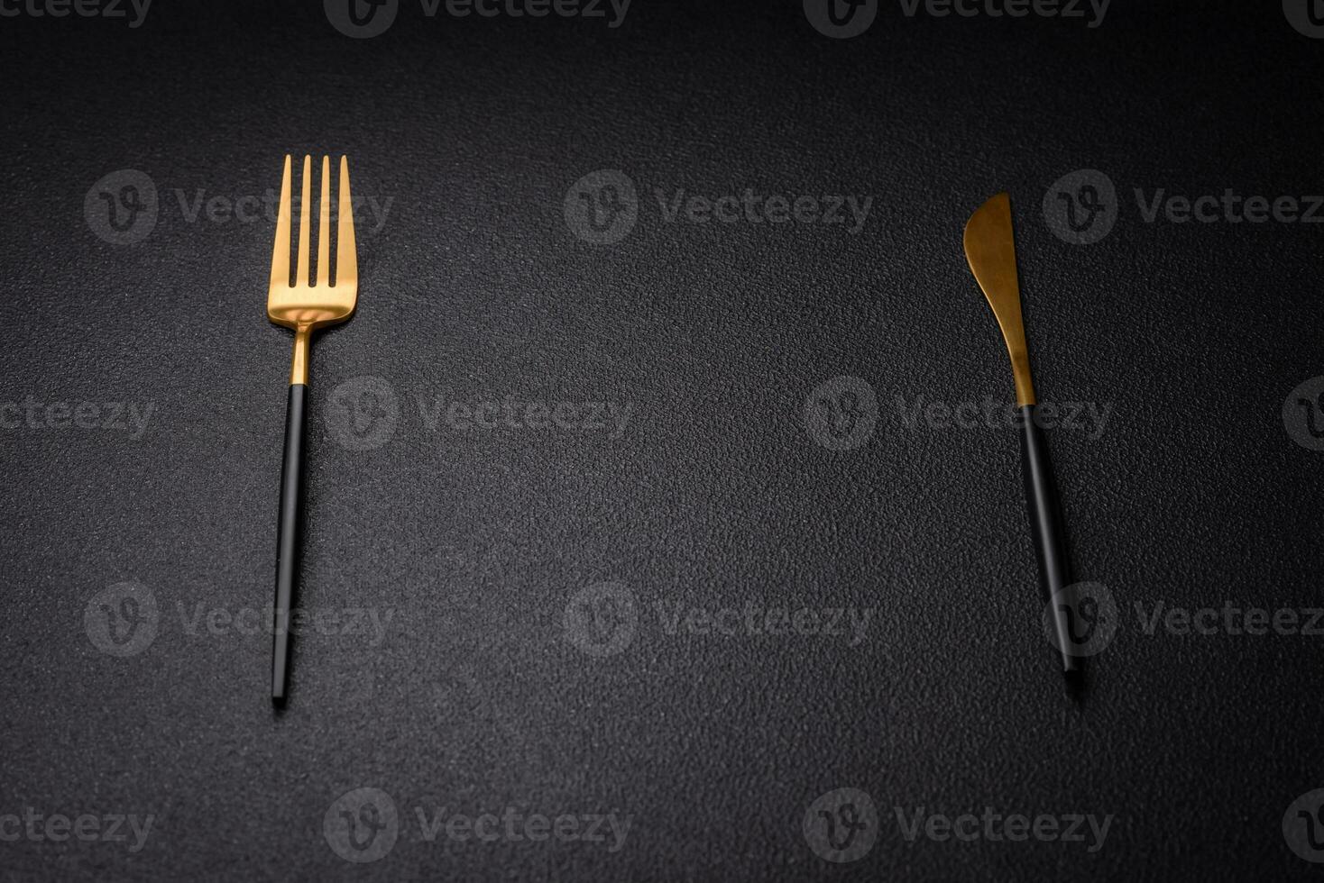 Kitchen knife and fork made of steel with copy space photo