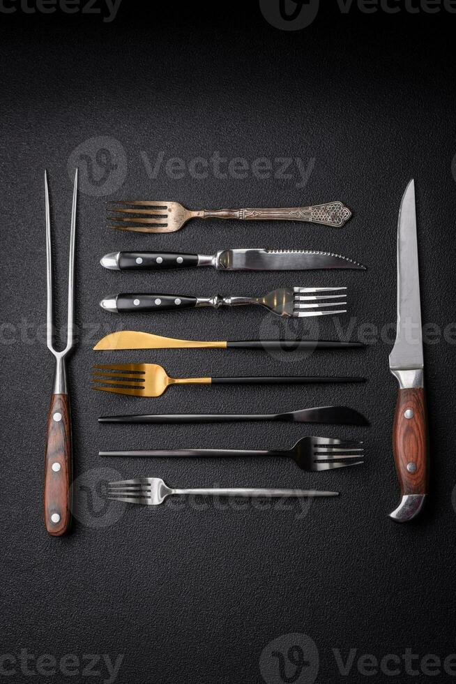 Kitchen knife and fork made of steel with copy space photo