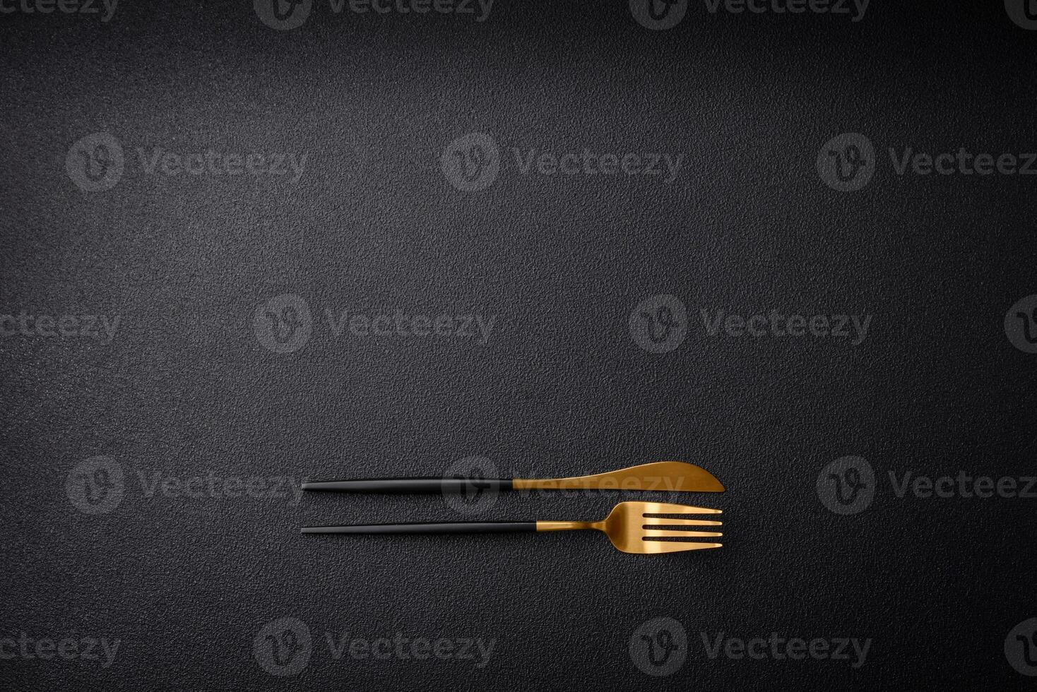 Kitchen knife and fork made of steel with copy space photo