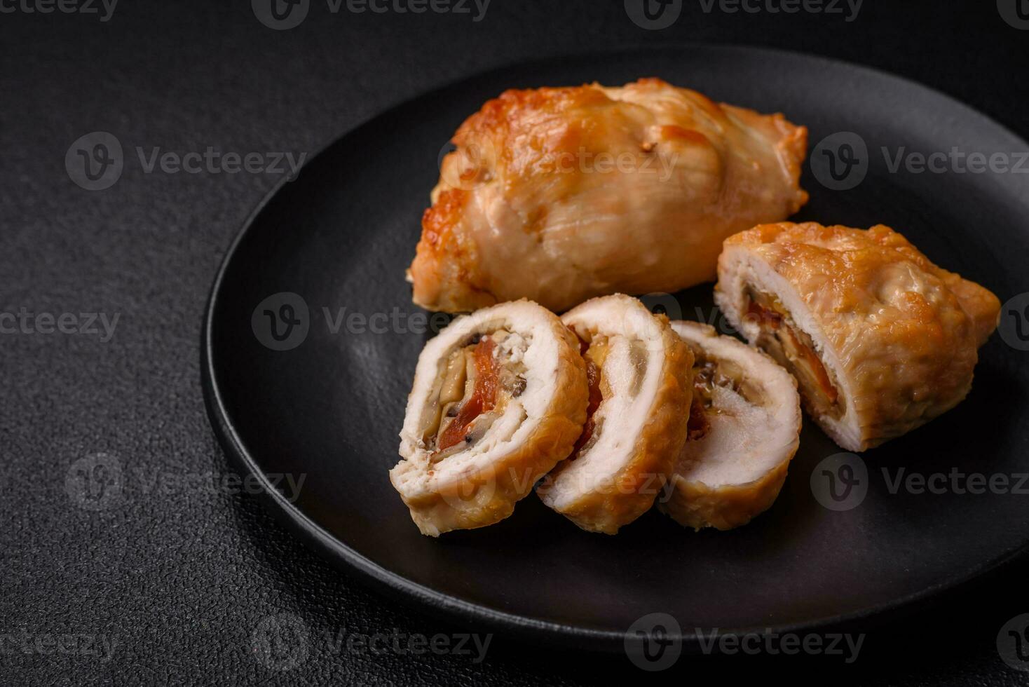 Delicious fresh meat roll made from chicken fillet, mushrooms, spices and herbs photo