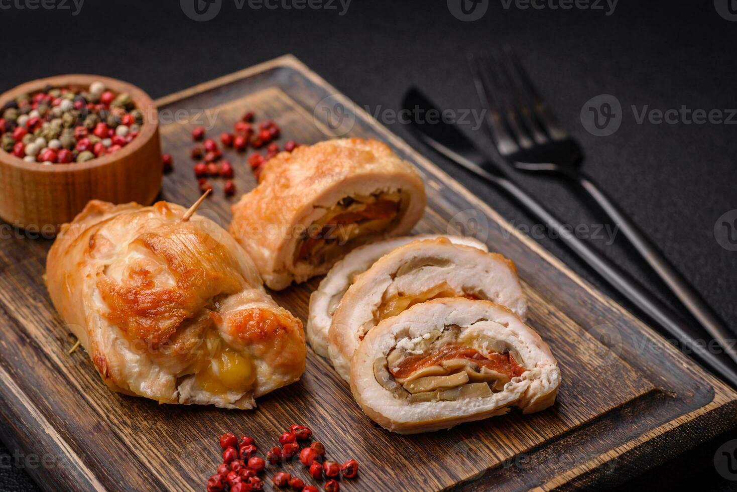 Delicious fresh meat roll made from chicken fillet, mushrooms, spices and herbs photo
