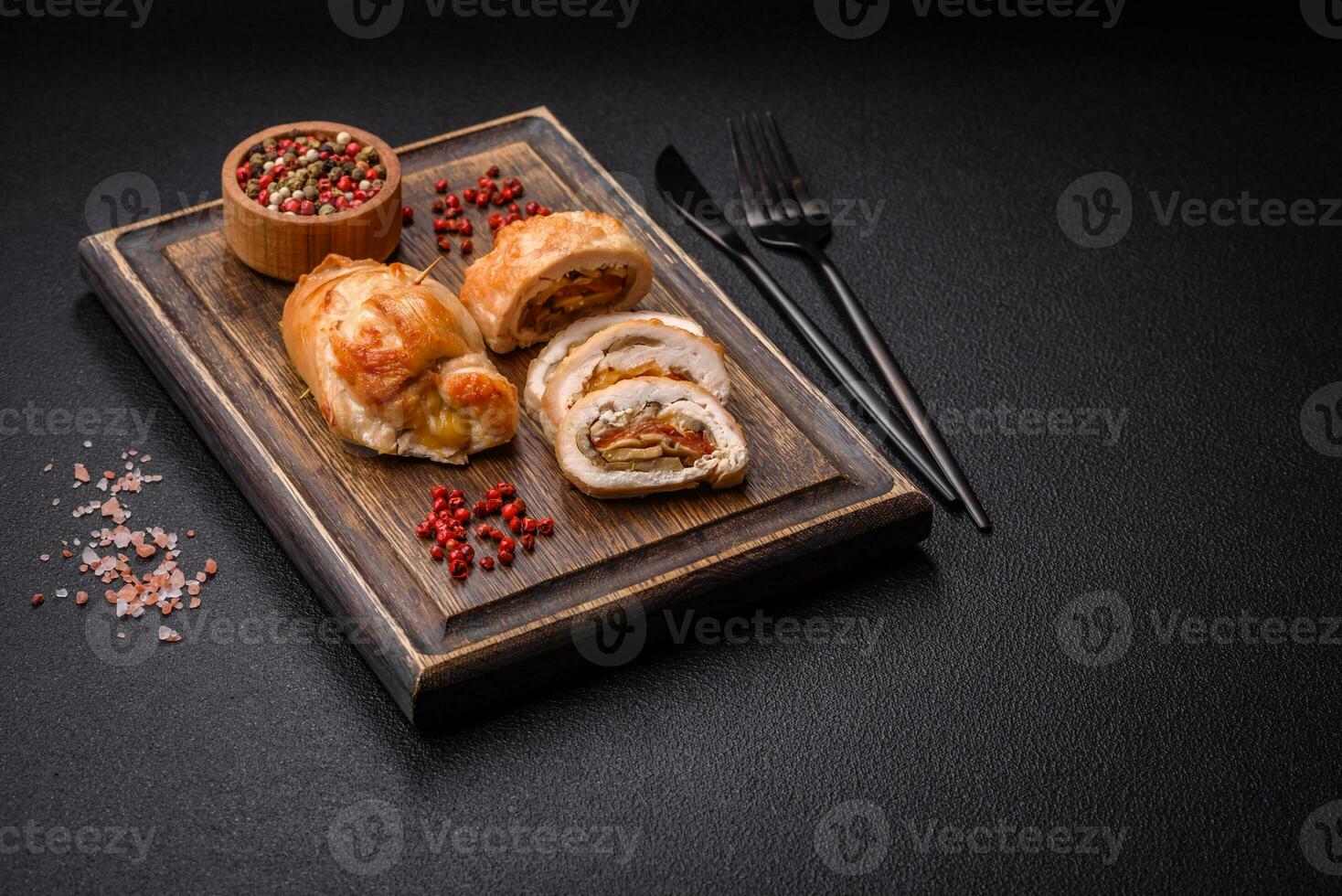 Delicious fresh meat roll made from chicken fillet, mushrooms, spices and herbs photo