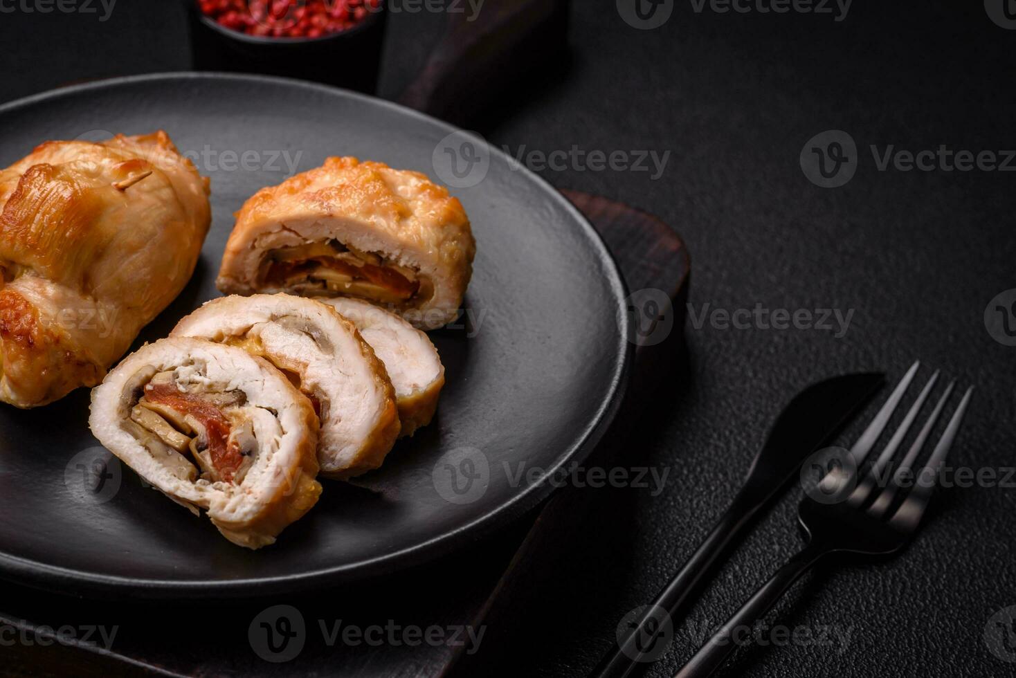 Delicious fresh meat roll made from chicken fillet, mushrooms, spices and herbs photo