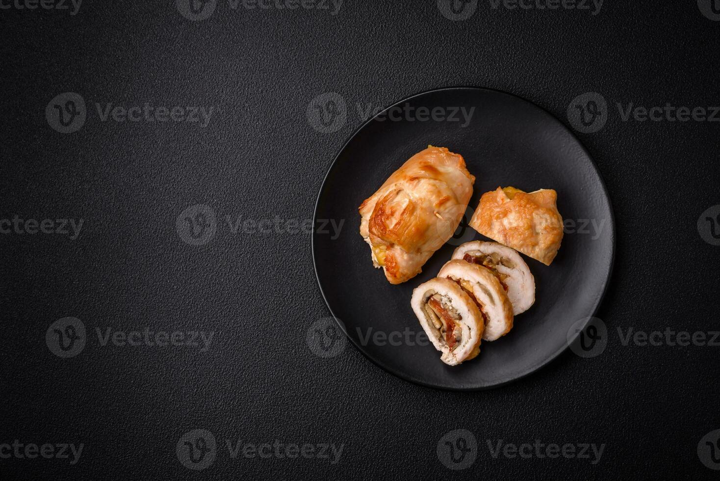 Delicious fresh meat roll made from chicken fillet, mushrooms, spices and herbs photo
