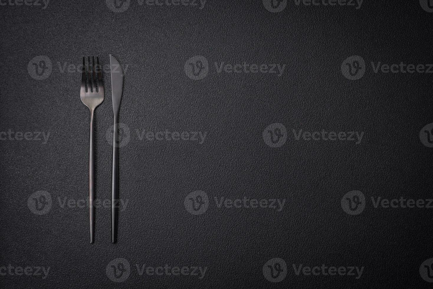 Kitchen knife and fork made of steel with copy space photo