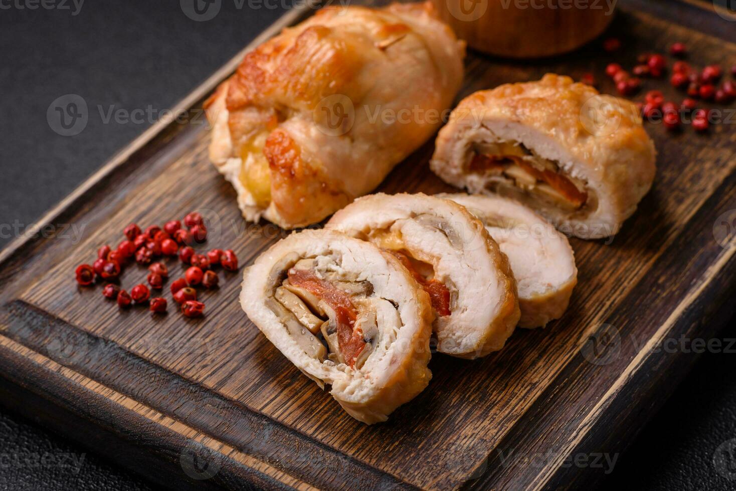 Delicious fresh meat roll made from chicken fillet, mushrooms, spices and herbs photo