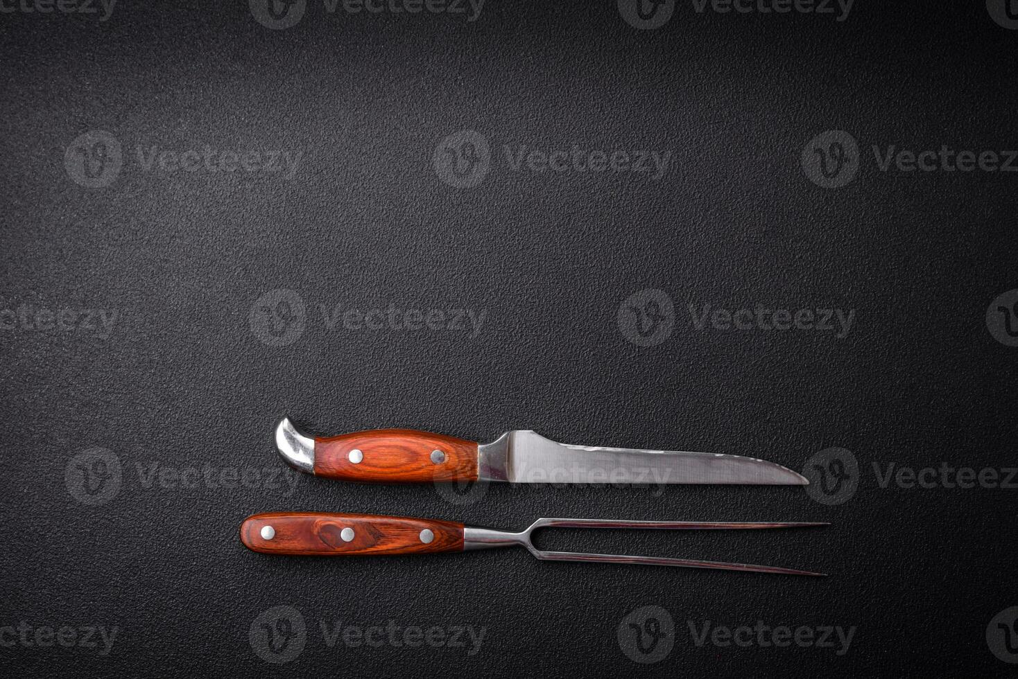 Kitchen knife and fork made of steel with copy space photo