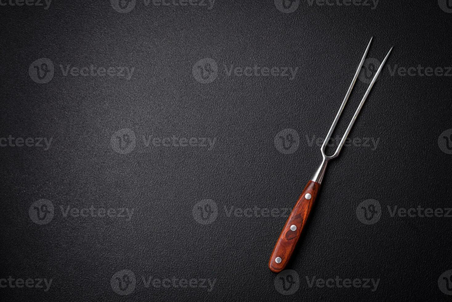 Kitchen knife and fork made of steel with copy space photo