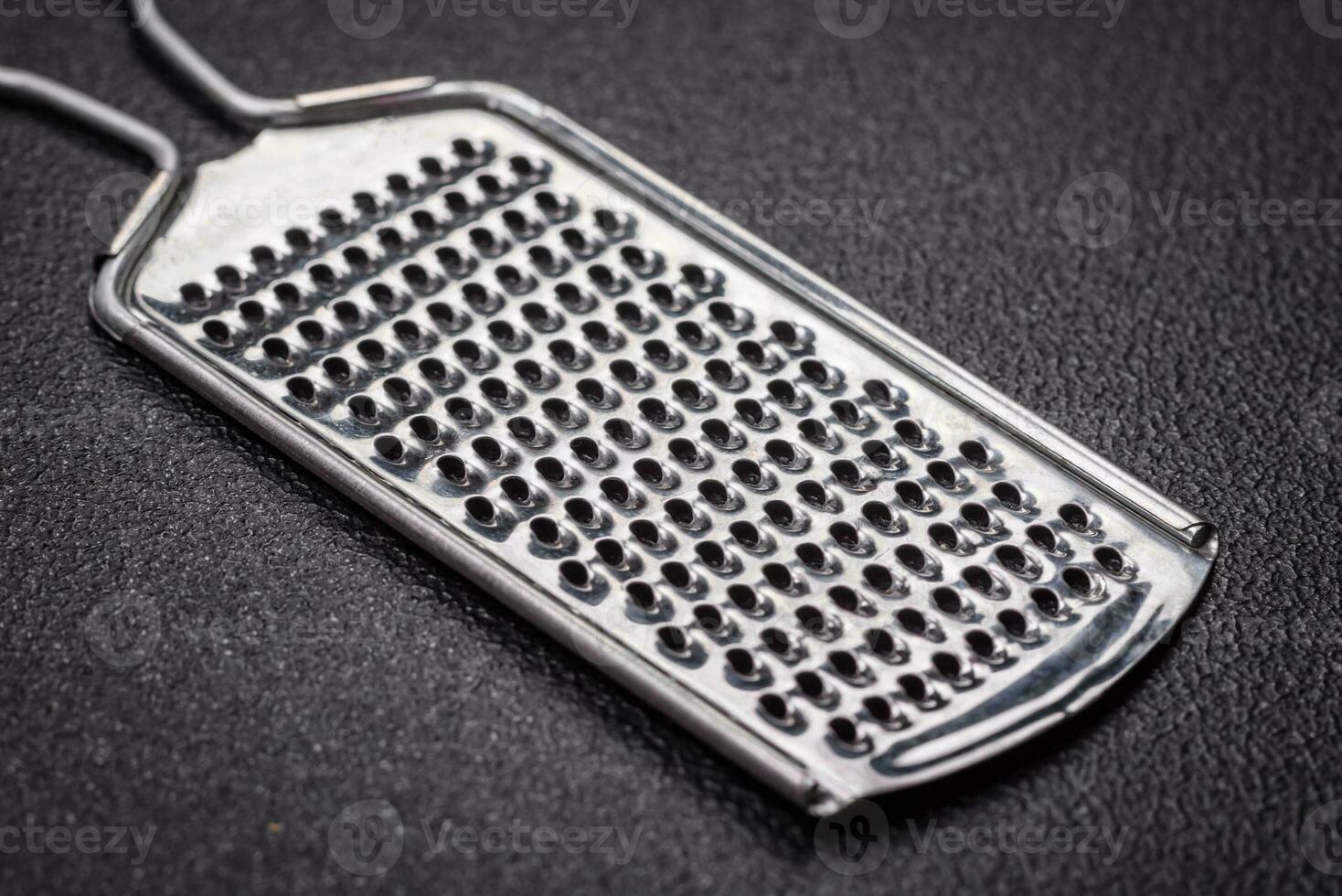 Beautiful small metal kitchen grater with handle photo