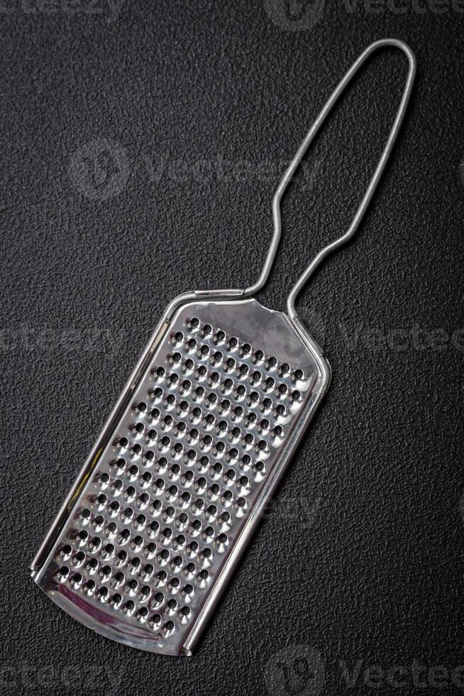 Beautiful small metal kitchen grater with handle photo