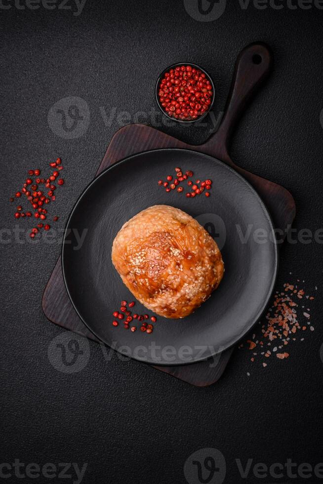 Delicious baked chicken or turkey meat roll with salt and spices photo