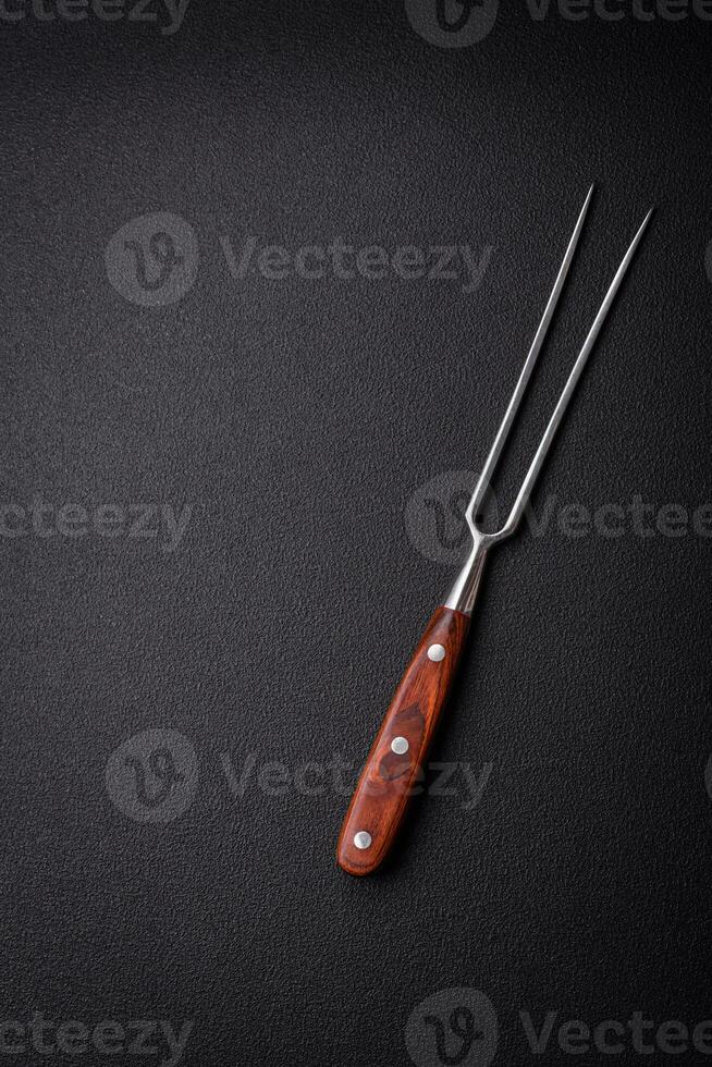 Kitchen knife and fork made of steel with copy space photo