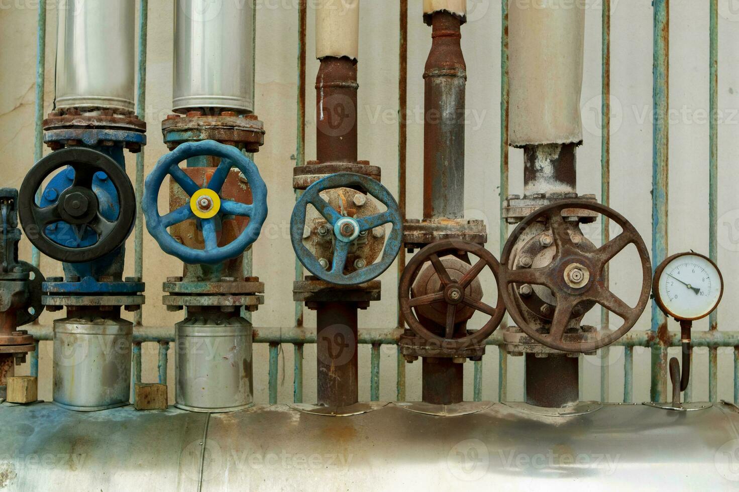 old water steam leak valve in old industry factory photo