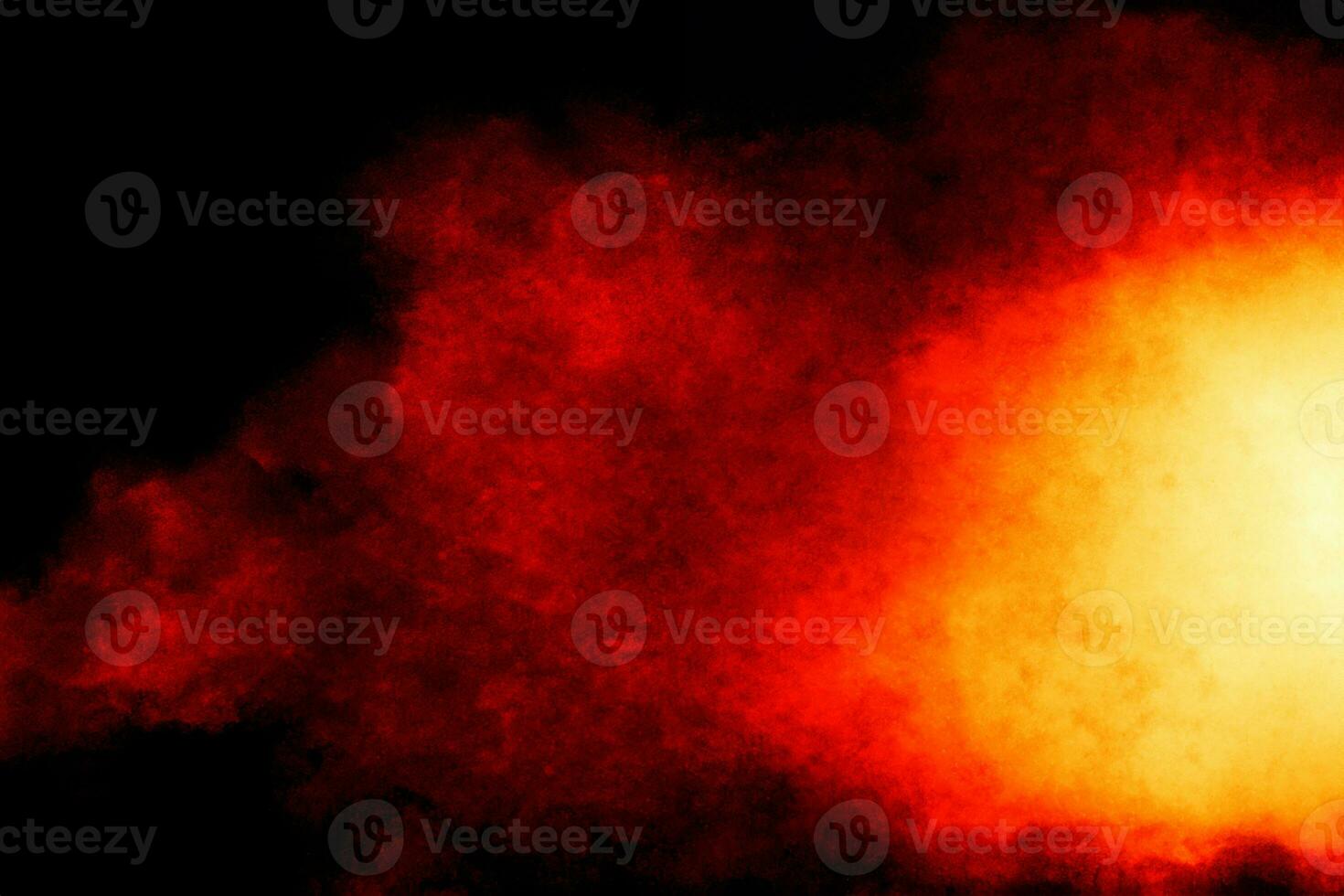 Red powder explosion cloud on black background. photo