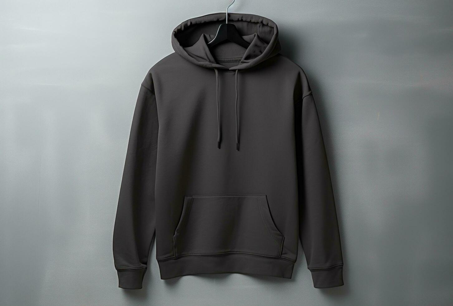 AI generated a black hooded sweatshirt hangs on a gray wall photo