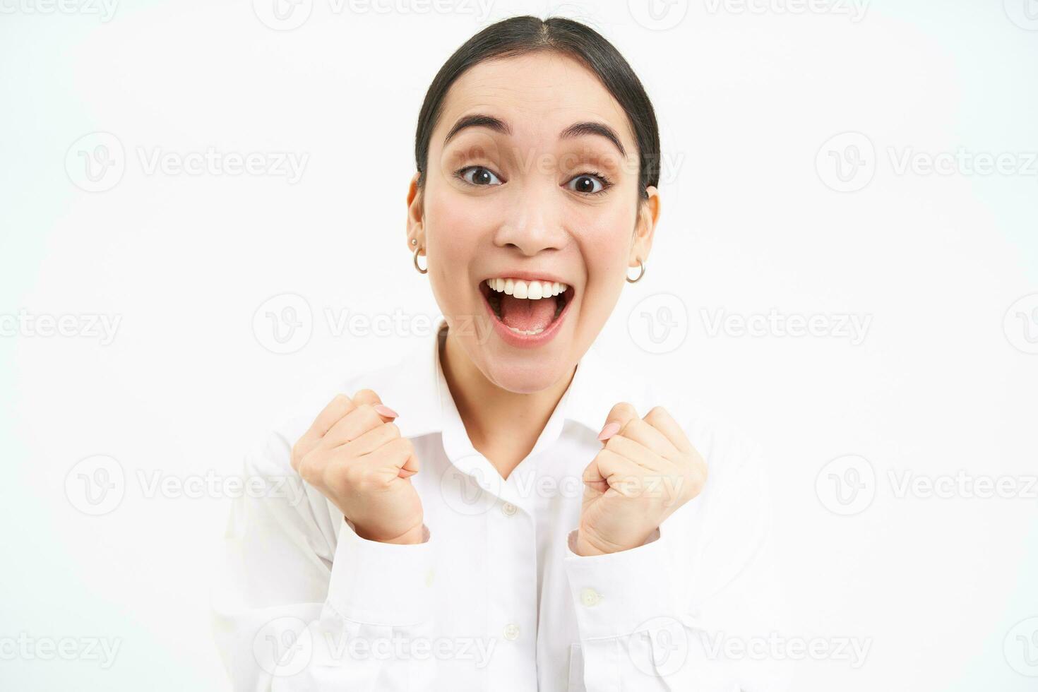 Enthusiastic asian businesswoman, office manager jumps from success