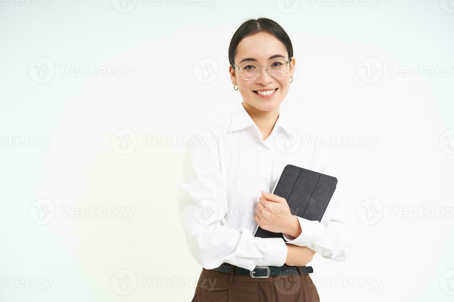 Beautiful asian woman, entrepreneur with digital tablet, working on business project, leading meeting and looking at notes on device, white background photo